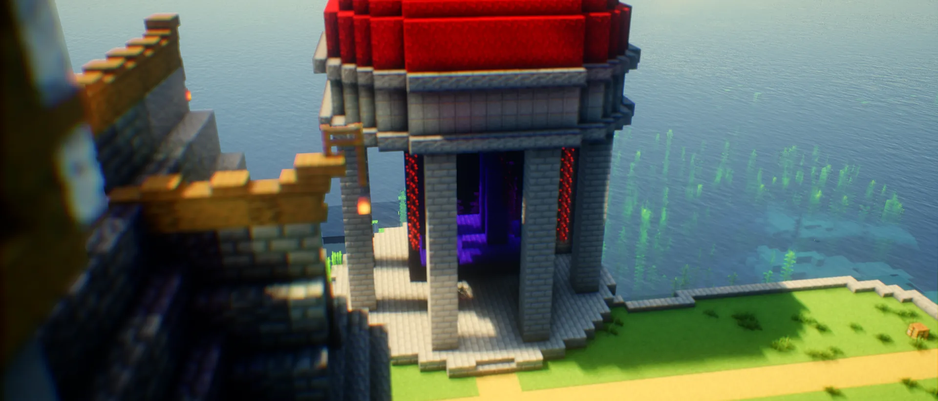 A stone temple with a red roof on the shore, a purple Nether portal glowing between its columns.